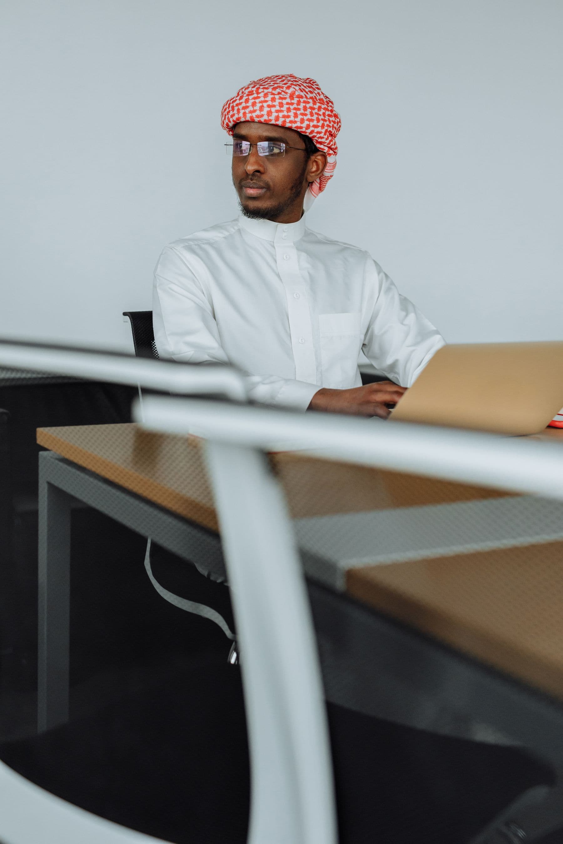 A licensed accountant working at a laptop